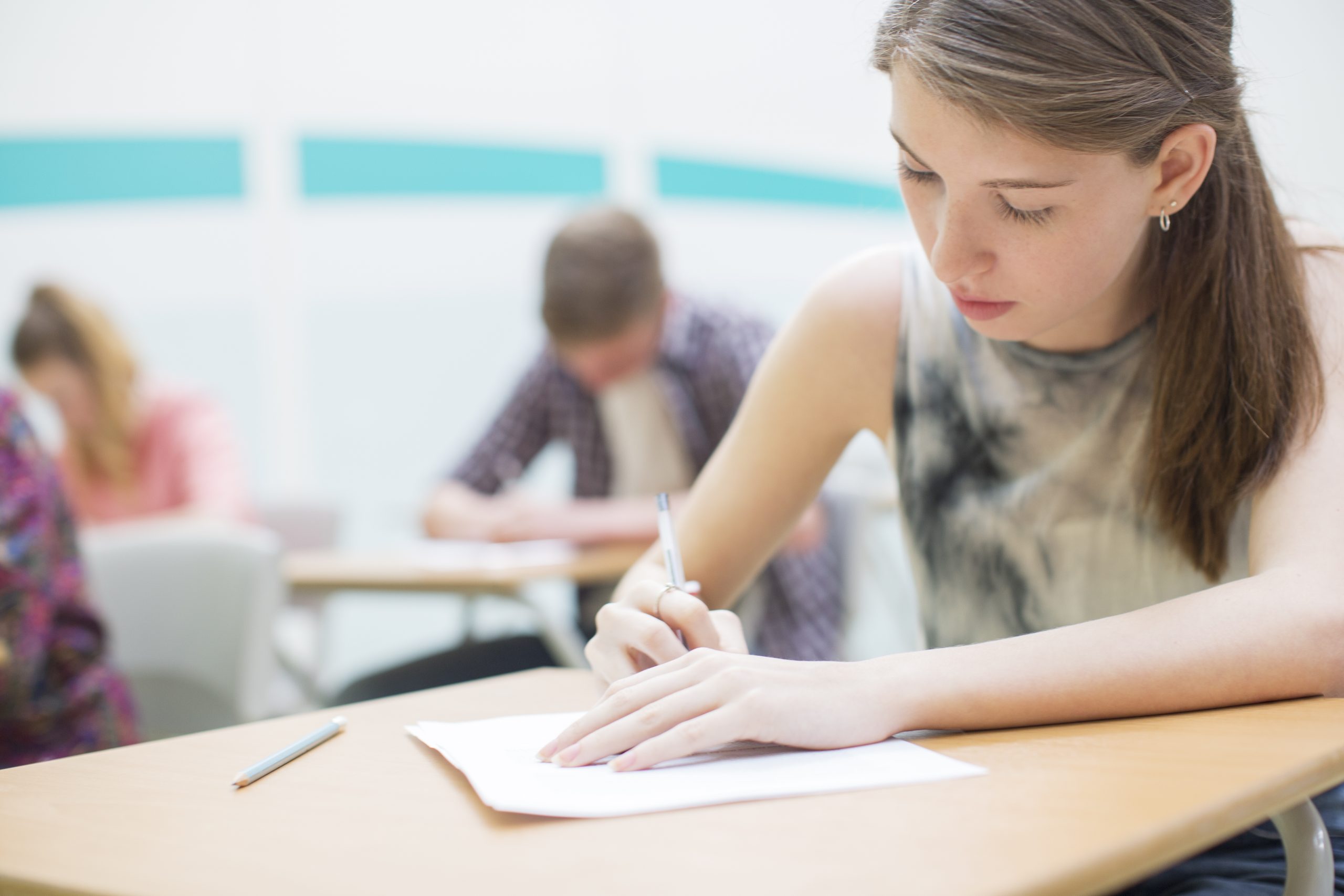 Более 16. Bacalaureat. Exam in School. Examination portrait Focused. Girl on the Exam stock.