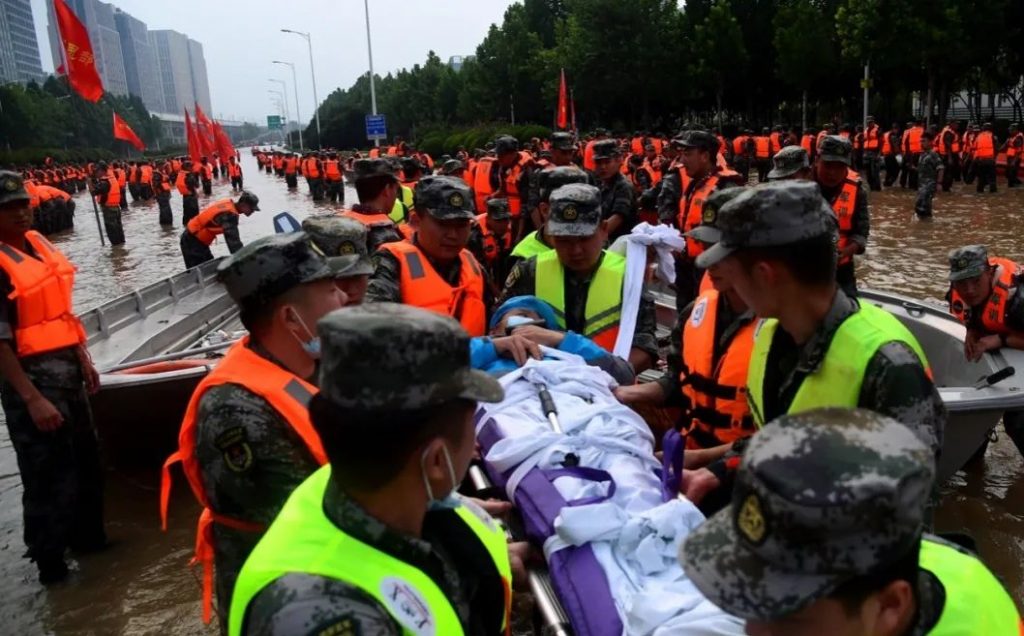 Rescue team are busy helping trapped residents to move to safe area, after Fanpo Village are badly hit by the historical flood in Liuhe Town of Xingyang City, central China's Henan Province, 22 July 2021.