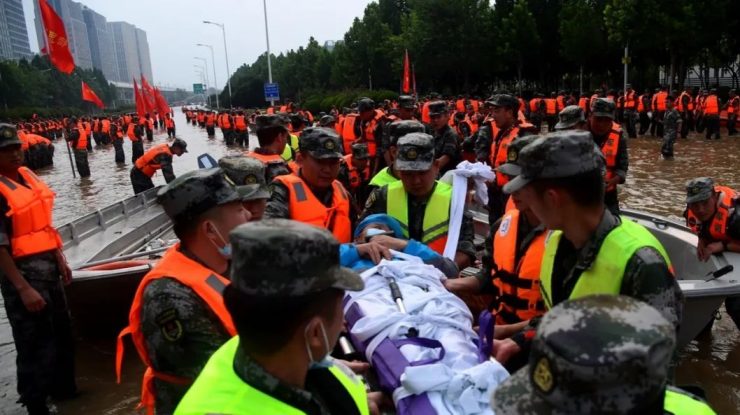 Rescue team are busy helping trapped residents to move to safe area, after Fanpo Village are badly hit by the historical flood in Liuhe Town of Xingyang City, central China's Henan Province, 22 July 2021.