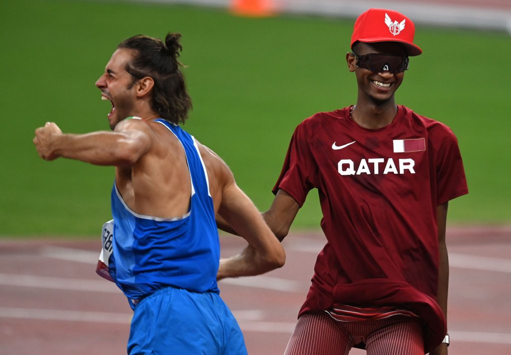 6614759 01.08.2021 Italy's Gianmarco Tamberi, left, and Qatar's Mutaz Essa Barshim celebrate after winning gold medals during the men's high jump final at the Tokyo 2020 Olympic Games at Shiokaze Park in Tokyo, Japan. Grigory Sysoev / Sputnik
