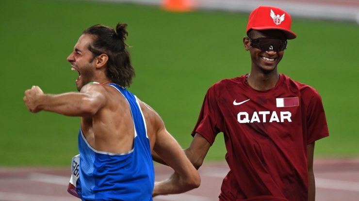 6614759 01.08.2021 Italy's Gianmarco Tamberi, left, and Qatar's Mutaz Essa Barshim celebrate after winning gold medals during the men's high jump final at the Tokyo 2020 Olympic Games at Shiokaze Park in Tokyo, Japan. Grigory Sysoev / Sputnik