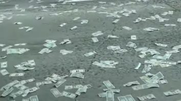 VIDEO. O autostradă a fost blocată de oamenii care au vrut să adune miile de bancnote pierdute pe traseu de o furgonetă