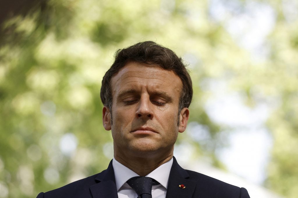 French president Emmanuel Macron pays his respect during the annual ceremony to honour victims of the slave trade in Paris, Tuesday May 10, 2022.(Christian Hartmann, Pool via AP)