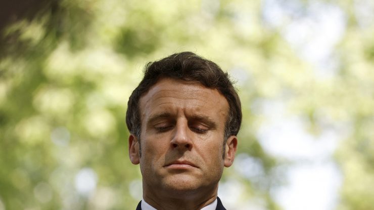 French president Emmanuel Macron pays his respect during the annual ceremony to honour victims of the slave trade in Paris, Tuesday May 10, 2022.(Christian Hartmann, Pool via AP)