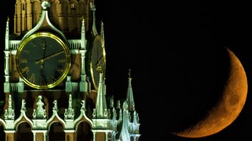 2823090 12.04.2016 The Moon over the Moscow Kremlin's Spasskaya (Savior) Tower. Vladimir Sergeev / Sputnik