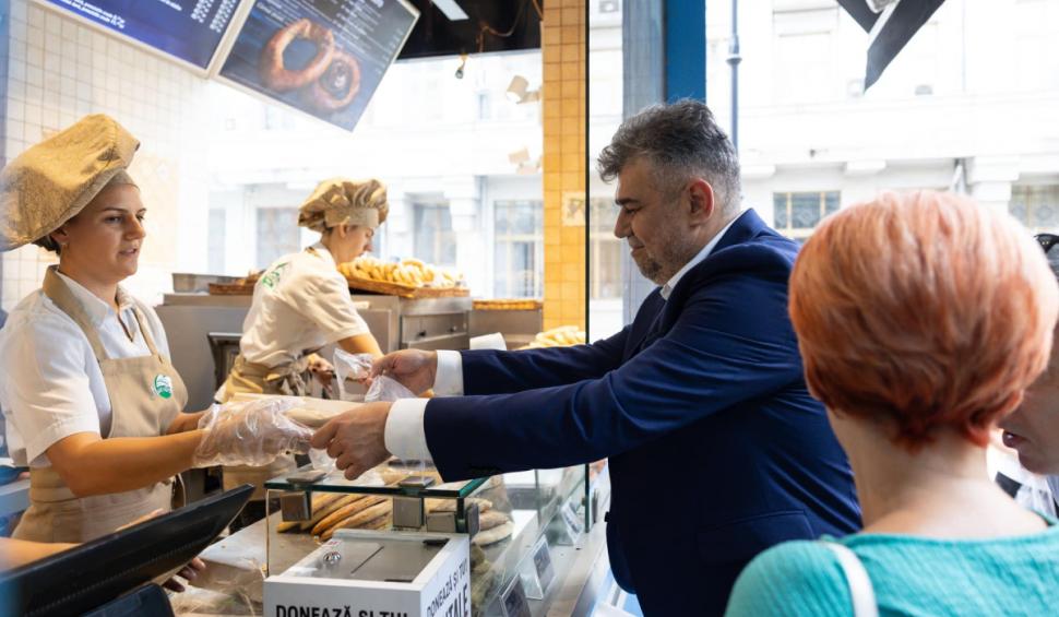 În lipsă de politici publice, principalii candidați la Președinție au început să le arate românilor ce mănâncă. Ciolacu postează clipuri prin care e la coadă la covrigi