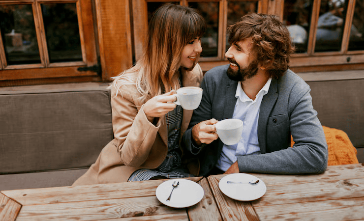 Romantic moments elegant couple love sitting cafe drinking coffee having conversation enjoying time spend with each other 273443