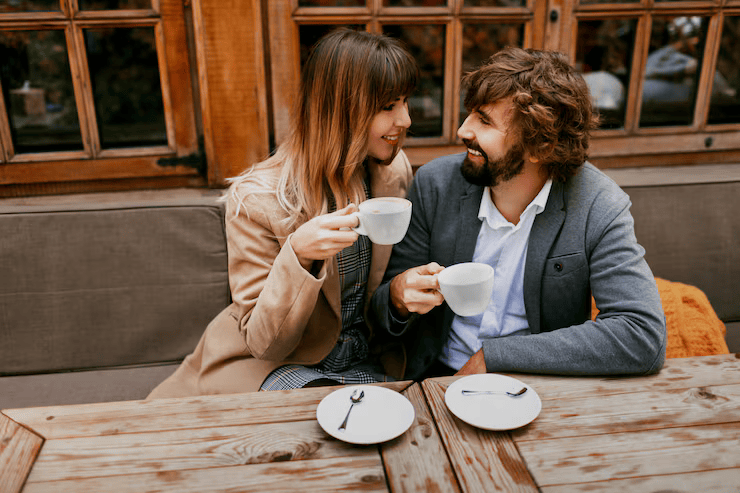 Romantic moments elegant couple love sitting cafe drinking coffee having conversation enjoying time spend with each other 273443